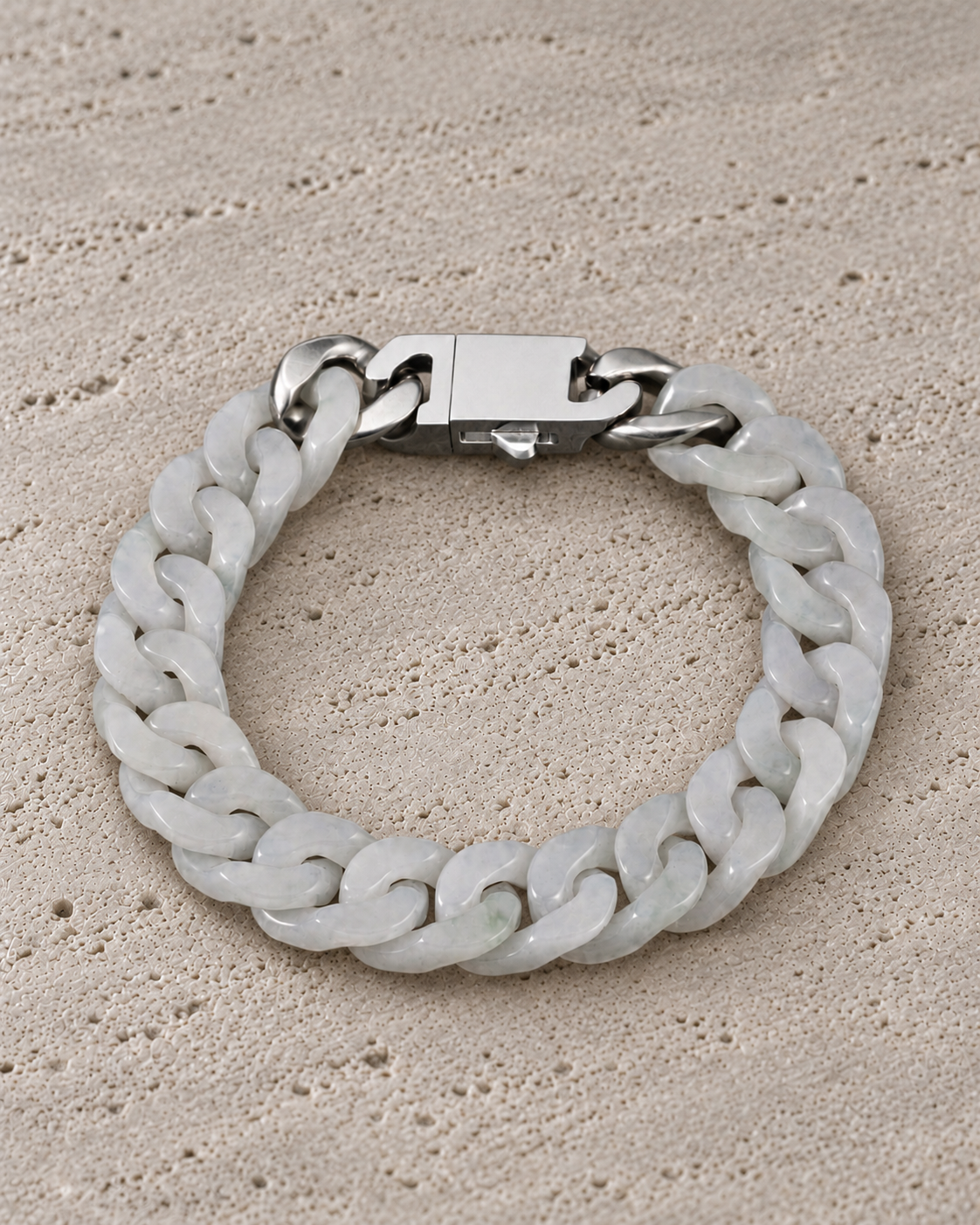 Classic Cuban Link Chain Bracelet in White Jade, product view on warm grey stone.