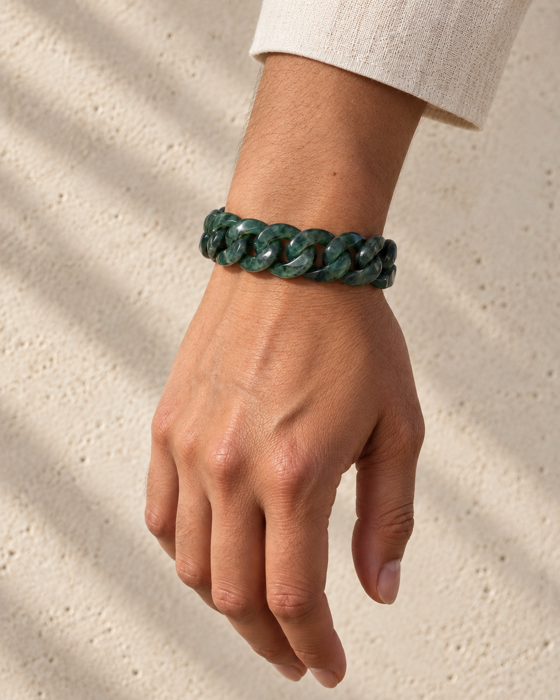 Single Piece Carved Cuban Chain Bracelet in Dark Green Jade, worn on the wrist.