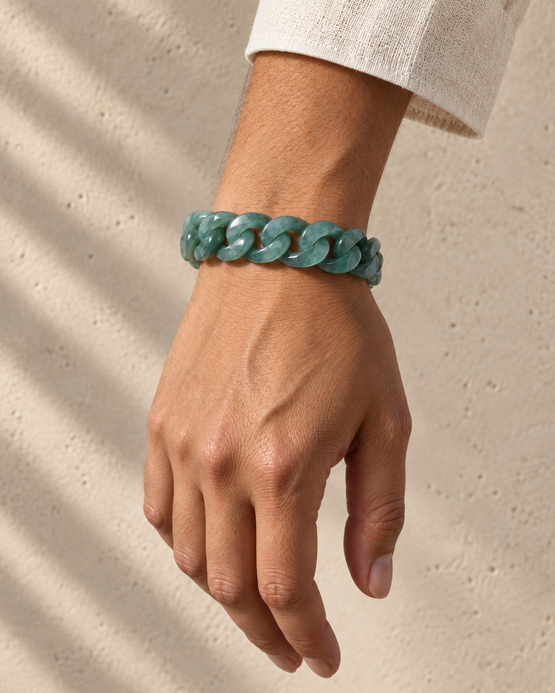 Single Piece Carved Cuban Chain Bracelet in Top Icy Green Jade, worn on the wrist.