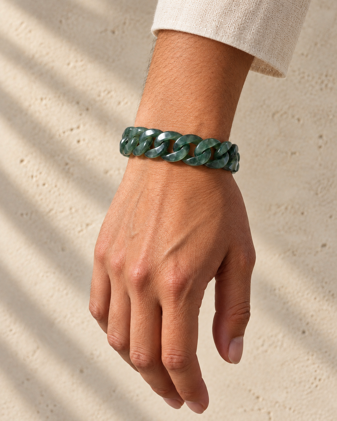 Classic Cuban Link Chain Bracelet in Top Icy Dark Green Guatemalan Jade, worn on the wrist.