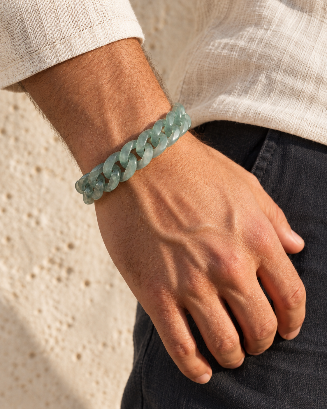 Classic Cuban Link Chain Bracelet in Top Icy Light Green Guatemalan Jade, worn on the wrist.