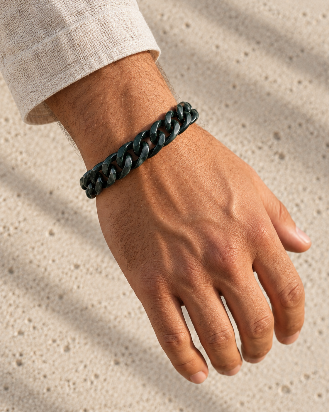 Single Piece Carved Cuban Chain Bracelet in Dark Green Jade, worn on the wrist.