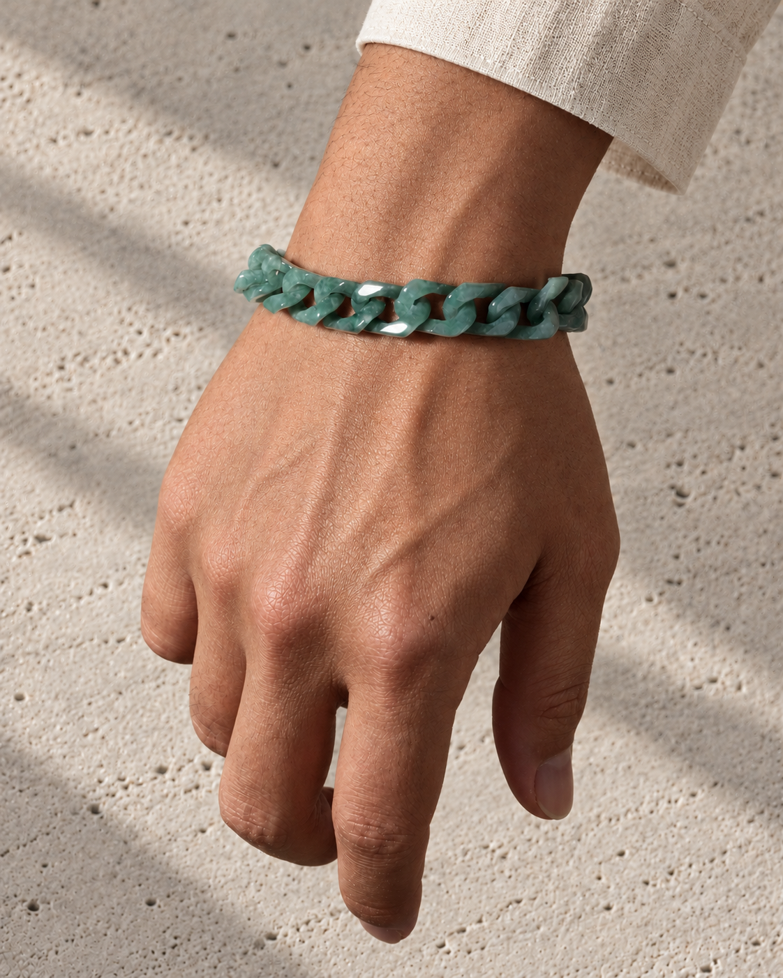 Single Piece Carved Cuban Chain Bracelet in Green Jade, worn on the wrist.