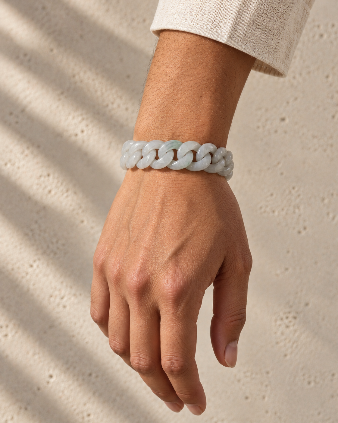 Classic Cuban Link Chain Bracelet in White Jade, worn on the wrist.