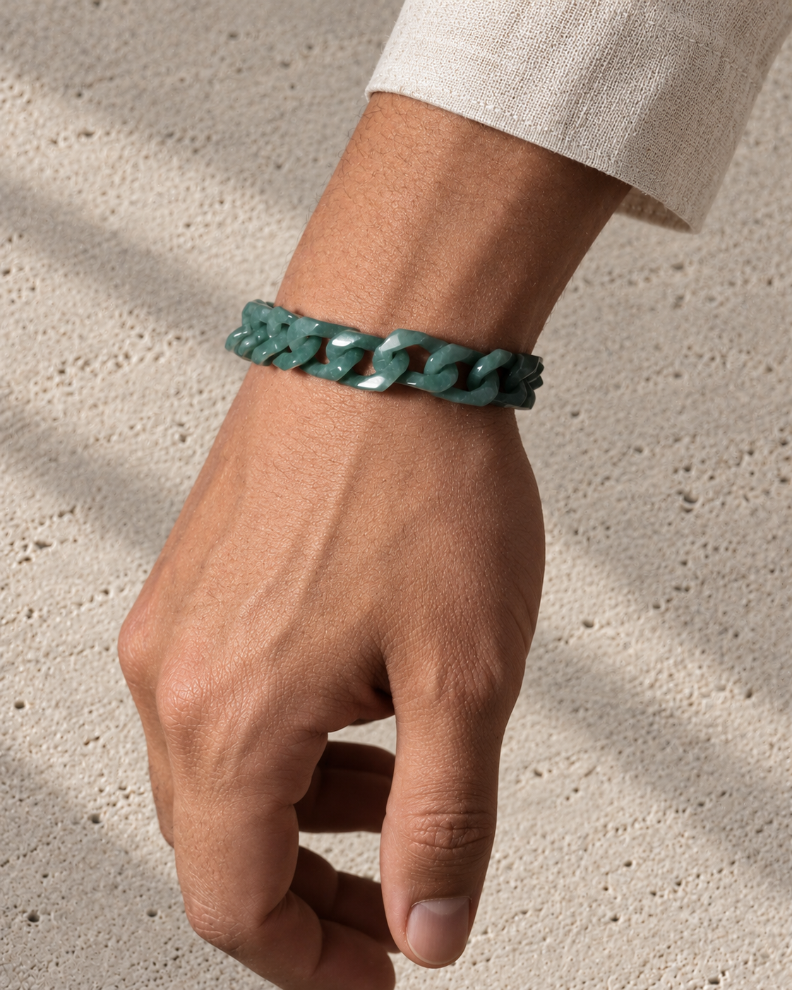 Single Piece Carved Cuban Chain Bracelet in Green Jade, worn on the wrist.