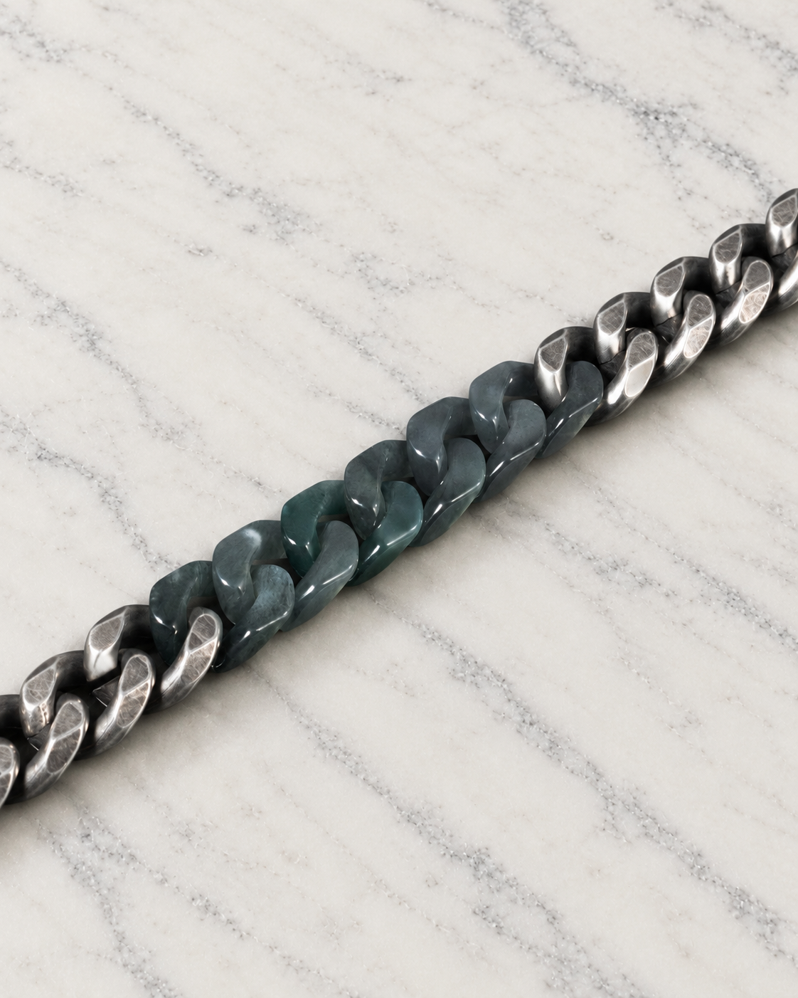 Classic Cuban Chain Bracelet in Black Jade with Oxidized Stainless Steel, material and construction close-up on ivory marble.