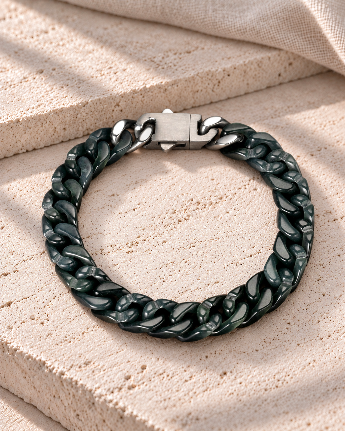 Classic Cuban Link Chain Bracelet in Black Jade, product view on pale limestone.