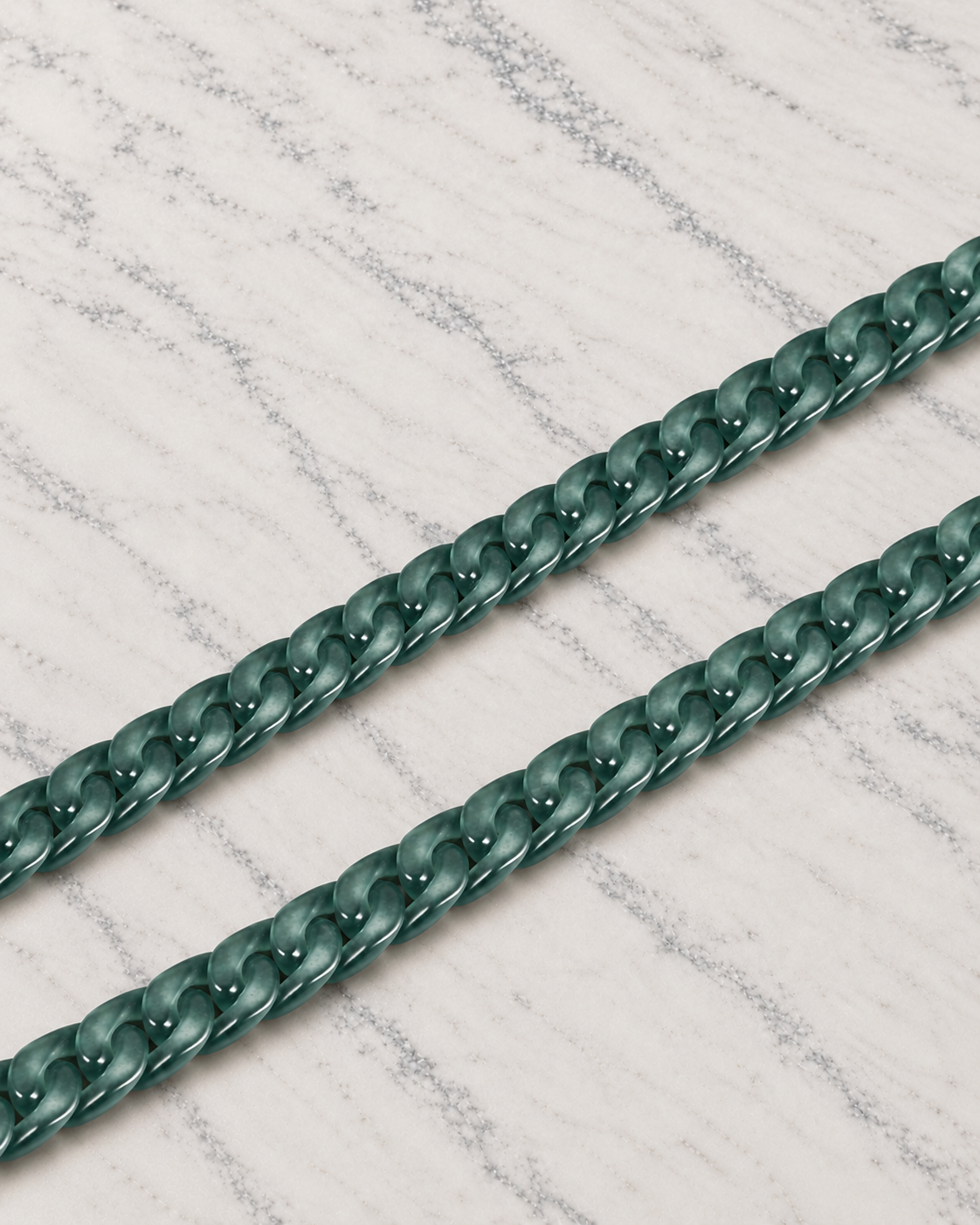Slim Style Cuban Link Chain Bracelet in Mayan Blue Jade, material and construction close-up on ivory marble.