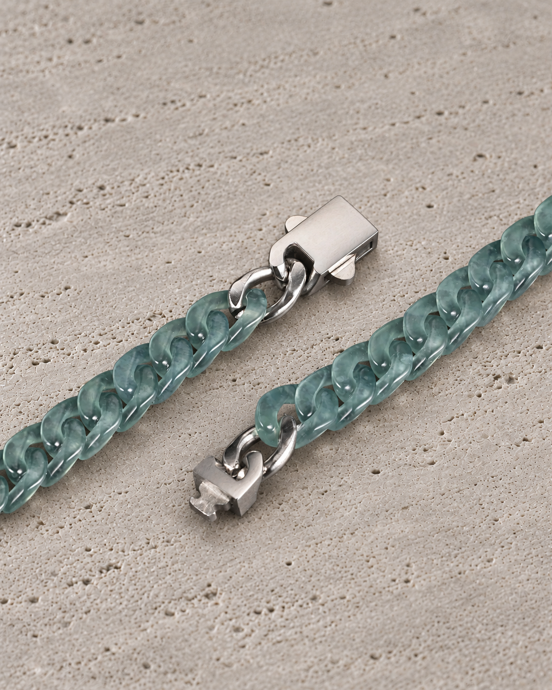 Slim Style Cuban Link Chain Bracelet in Mayan Blue Jade, clasp close-up on matte grey stone.