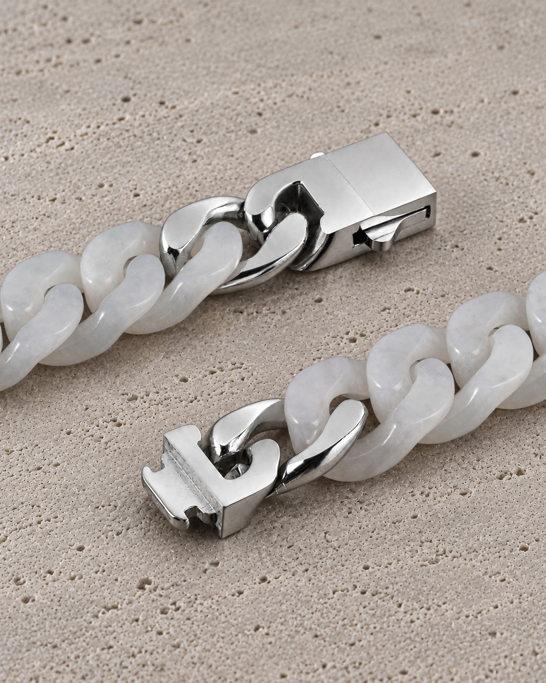 Classic Cuban Link Chain Bracelet in White Jade, clasp close-up on matte grey stone.