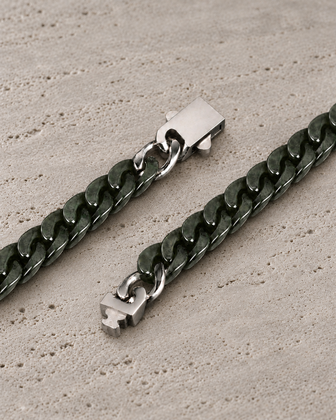 Classic Cuban Link Chain Bracelet in Dark Green Nephrite, clasp close-up on matte grey stone.
