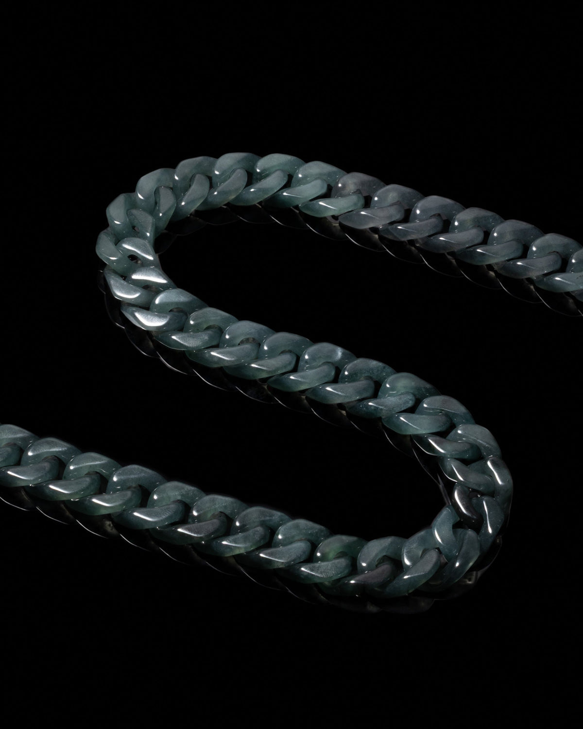 Carved black jade links