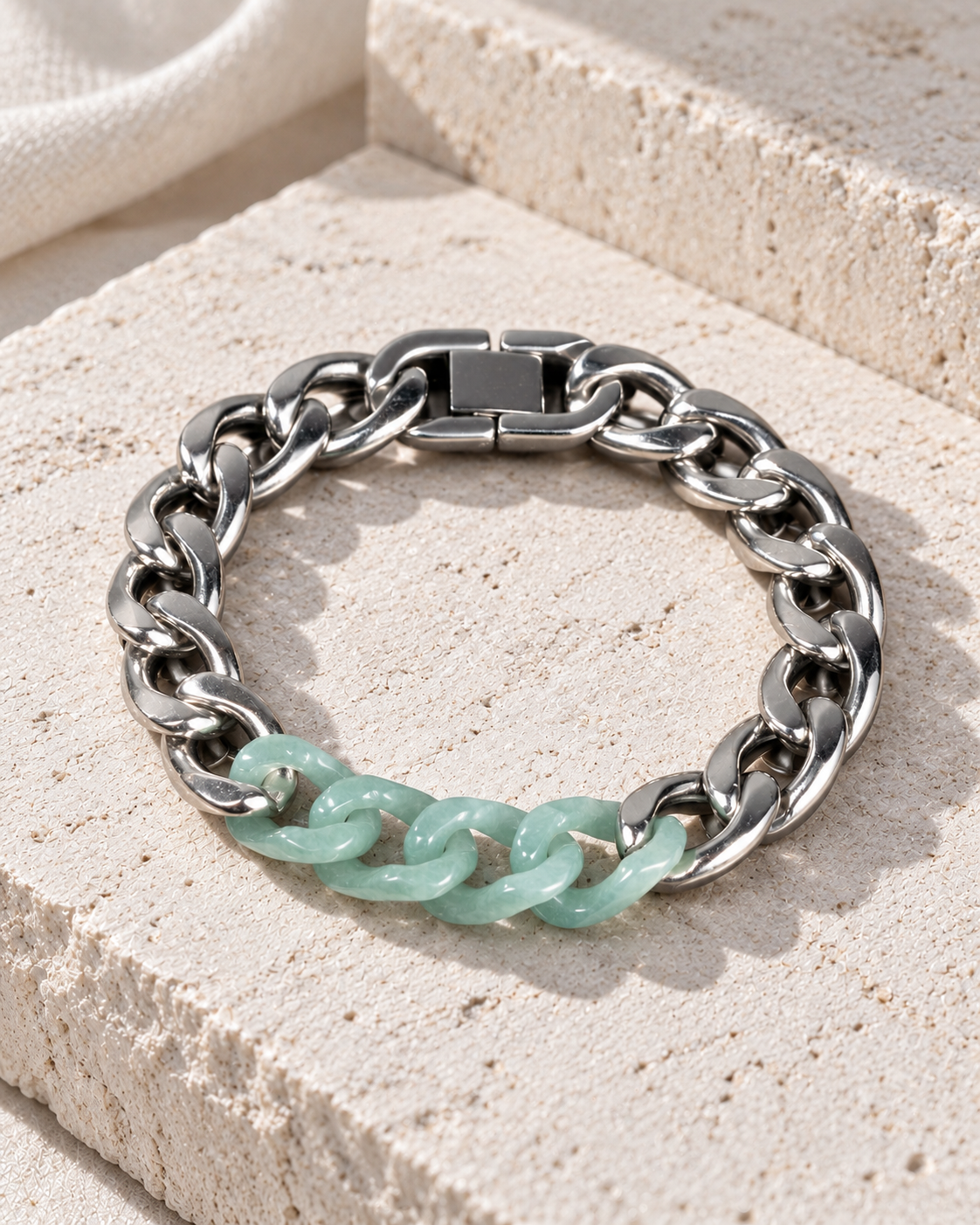 Classic Cuban Chain Bracelet In Green Jade With Stainless Steel on flat pale stone