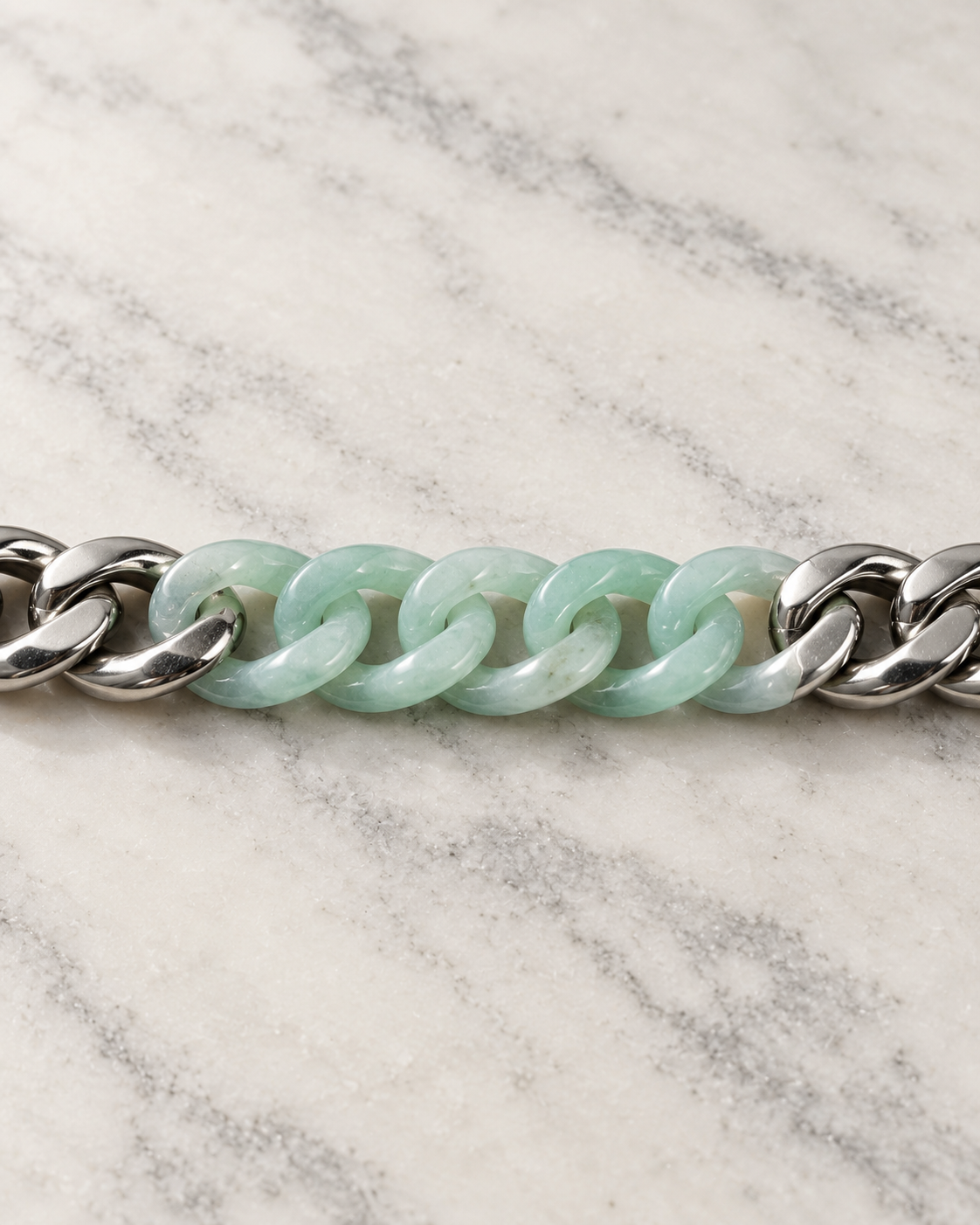 Classic Cuban Chain Bracelet In Green Jade With Stainless Steel on white stone: marble tabletop detail