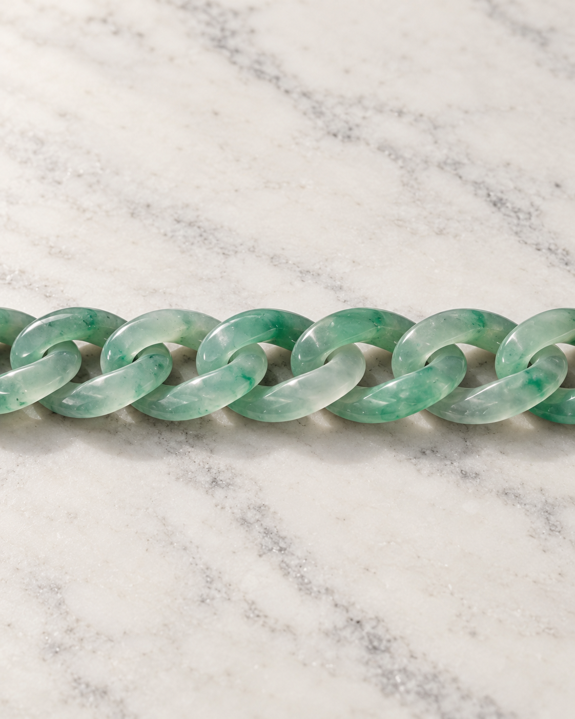 Classic Cuban Link Chain Bracelet In African Green Jade on white stone: marble tabletop detail
