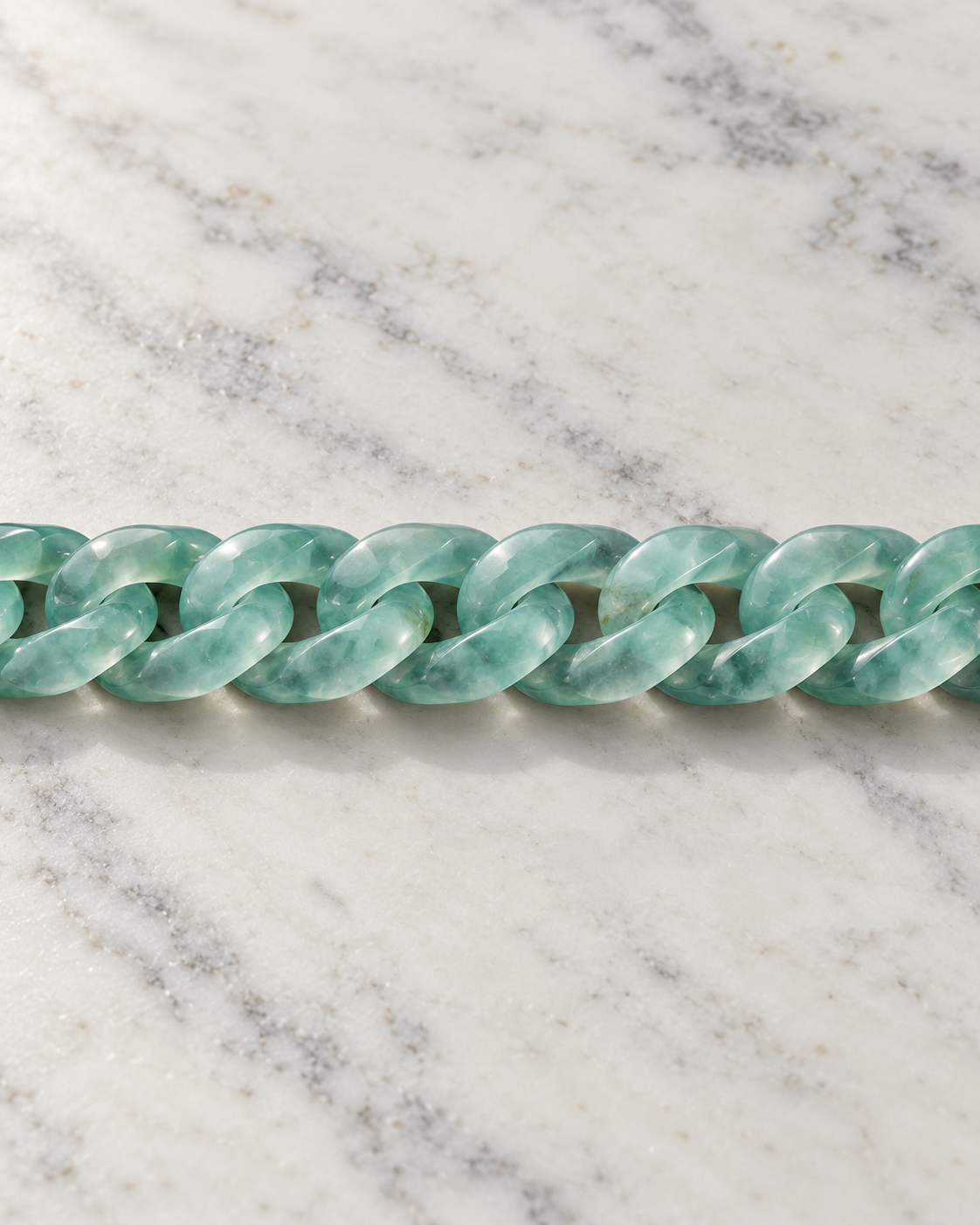 Classic Cuban Link Chain Bracelet In Blue-Green Jadeite on white stone: marble tabletop detail — 8.5 mm