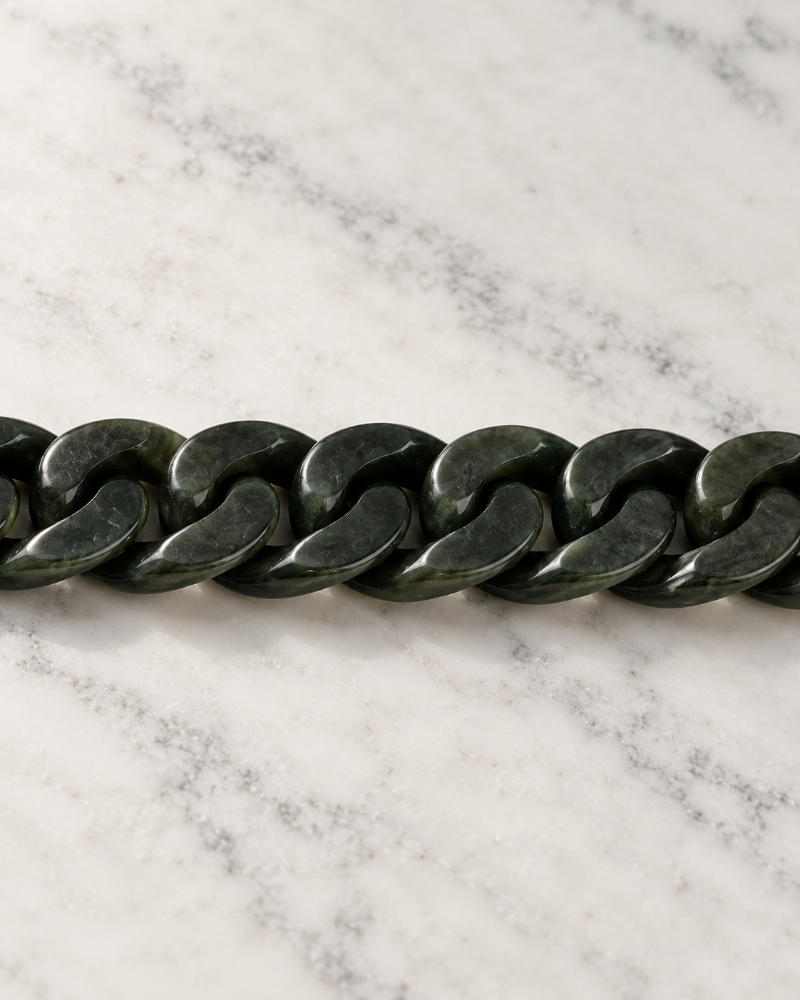 Classic Cuban Link Chain Bracelet In Dark Green Nephrite on white stone: marble tabletop detail