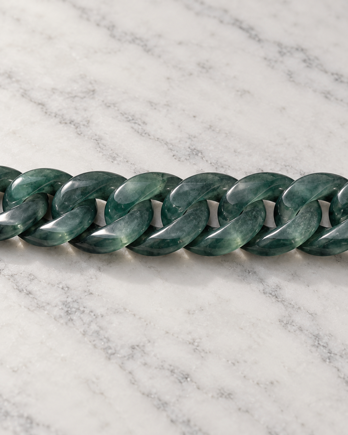 Classic Cuban Link Chain Bracelet In Top Icy Dark Green Guatemalan Jade on white stone: marble tabletop detail