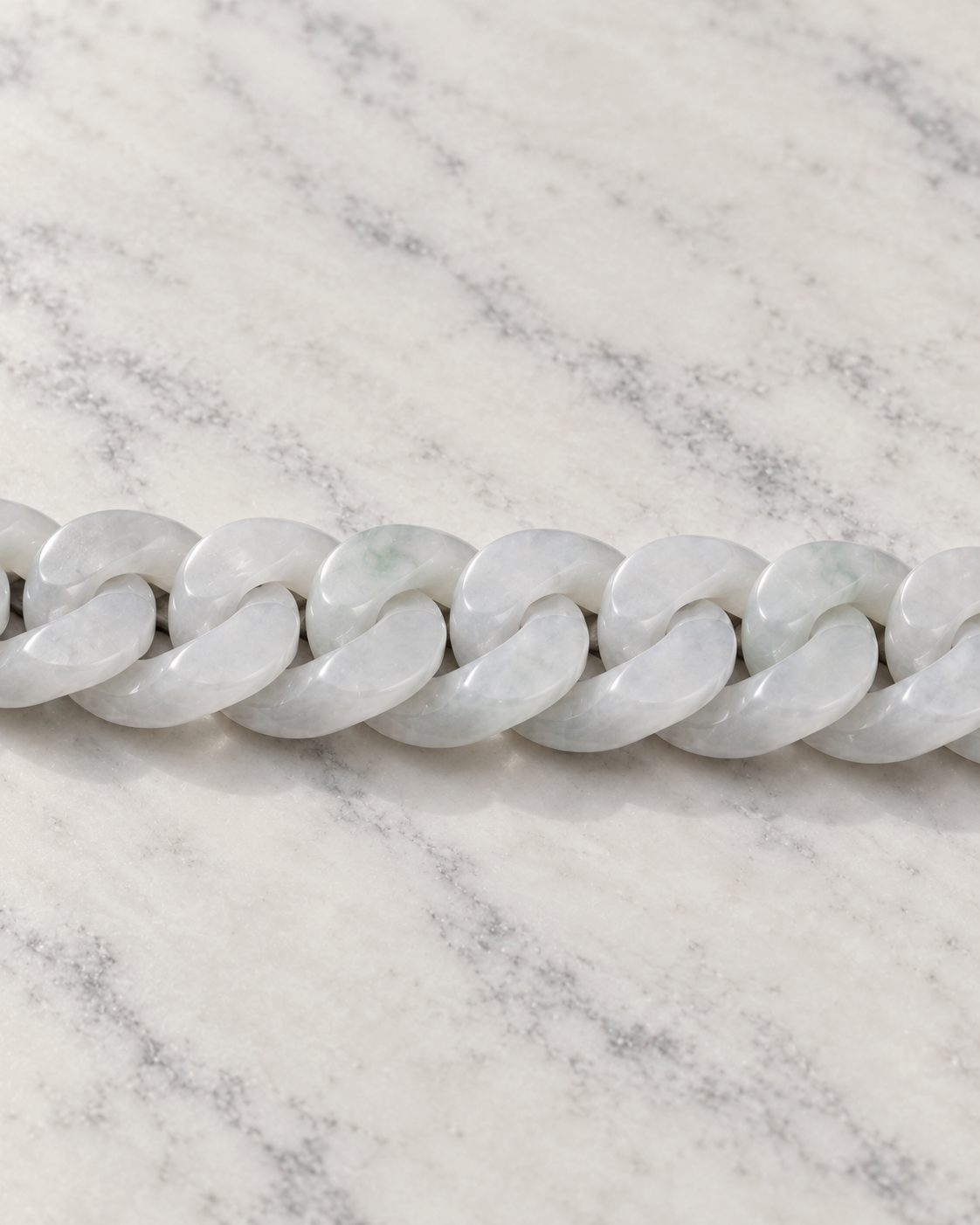 Classic Cuban Link Chain Bracelet In White Jade on white stone: marble tabletop detail