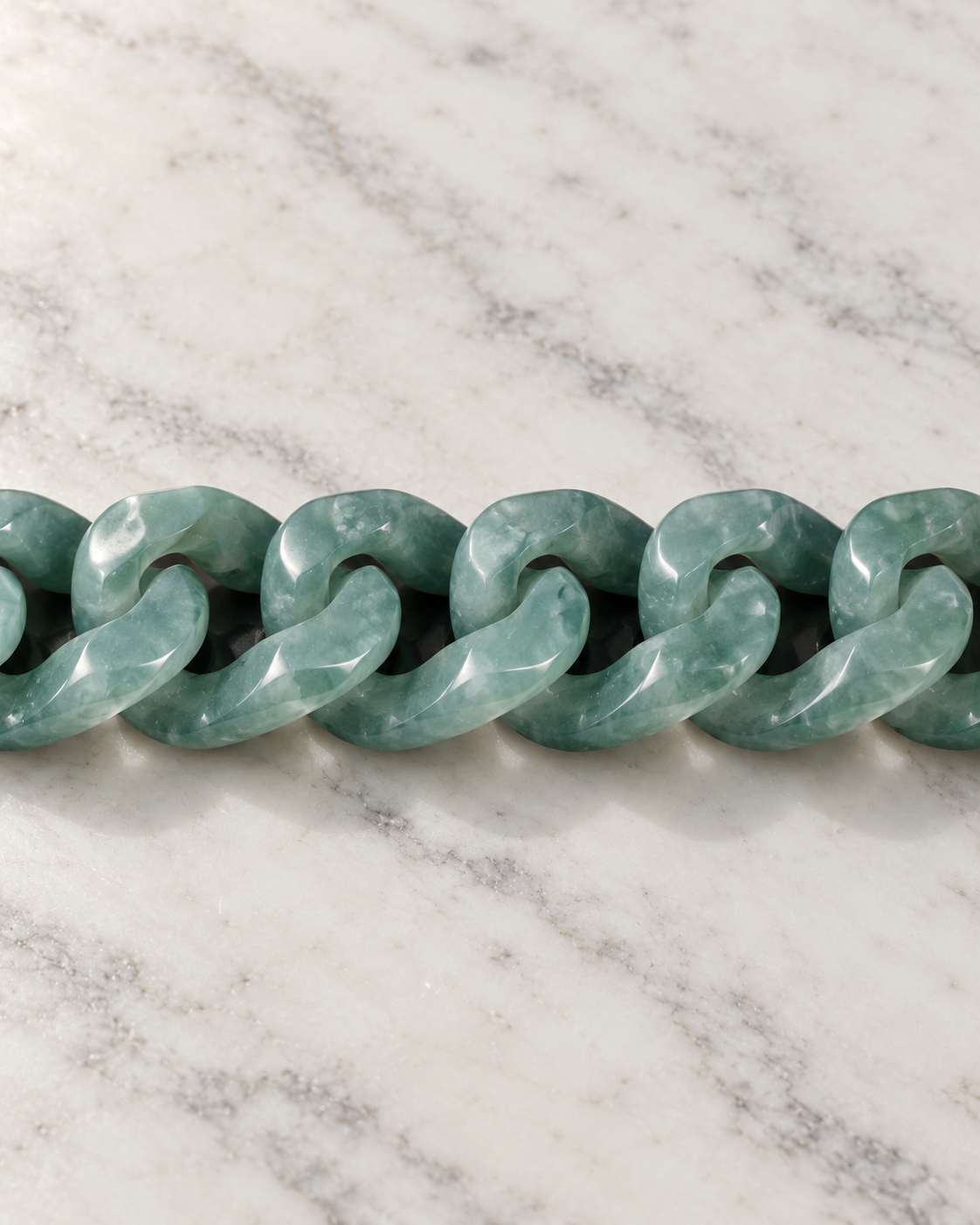 Single Piece Carved Cuban Chain Bracelet In Green Jade on white stone: marble tabletop detail — 15mm