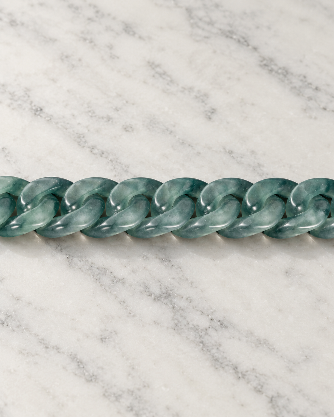 Slim Style Cuban Link Chain Bracelet In Mayan Blue Jade on white stone: marble tabletop detail — 10mm