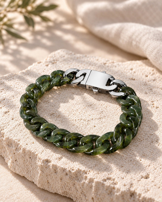 Classic Cuban Link Chain Bracelet In Light Green Nephrite on white stone: Angled limestone slab