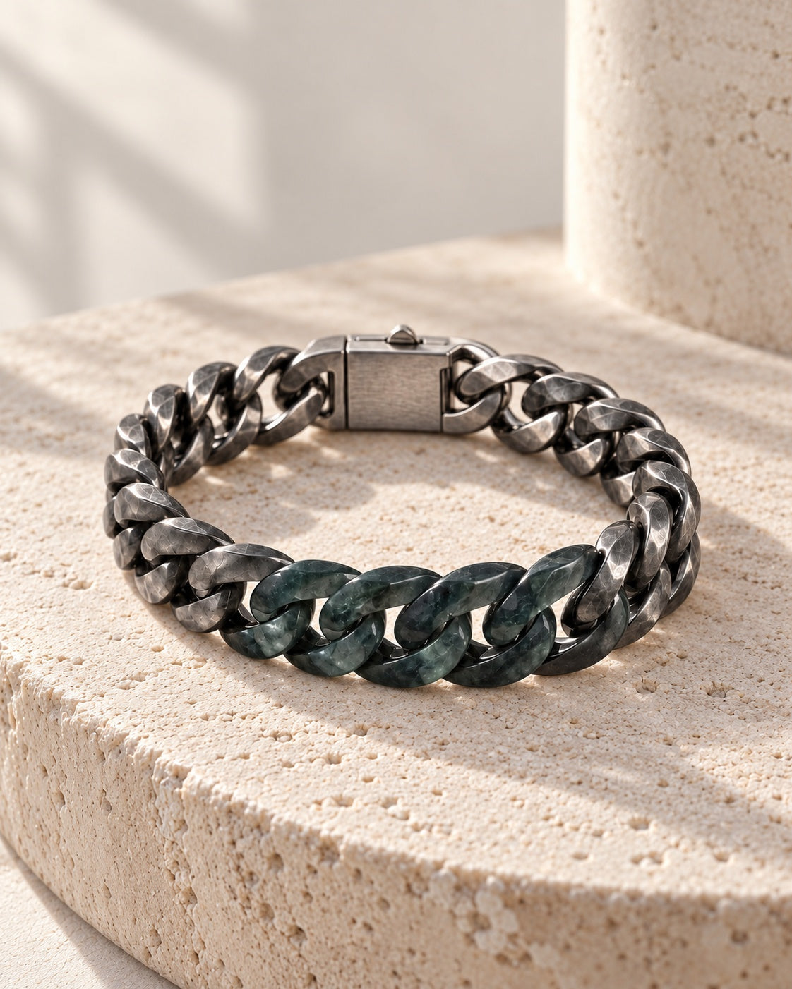 Classic Cuban Chain Bracelet In Black Jade With Oxidized Stainless Steel on white stone: Rounded travertine ledge