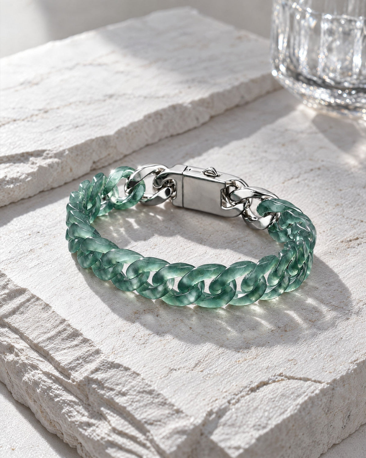 Classic Cuban Link Chain Bracelet In Top Icy Light Green Guatemalan Jade on pale stone
