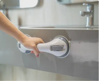 The grab bar mounted beside a sink